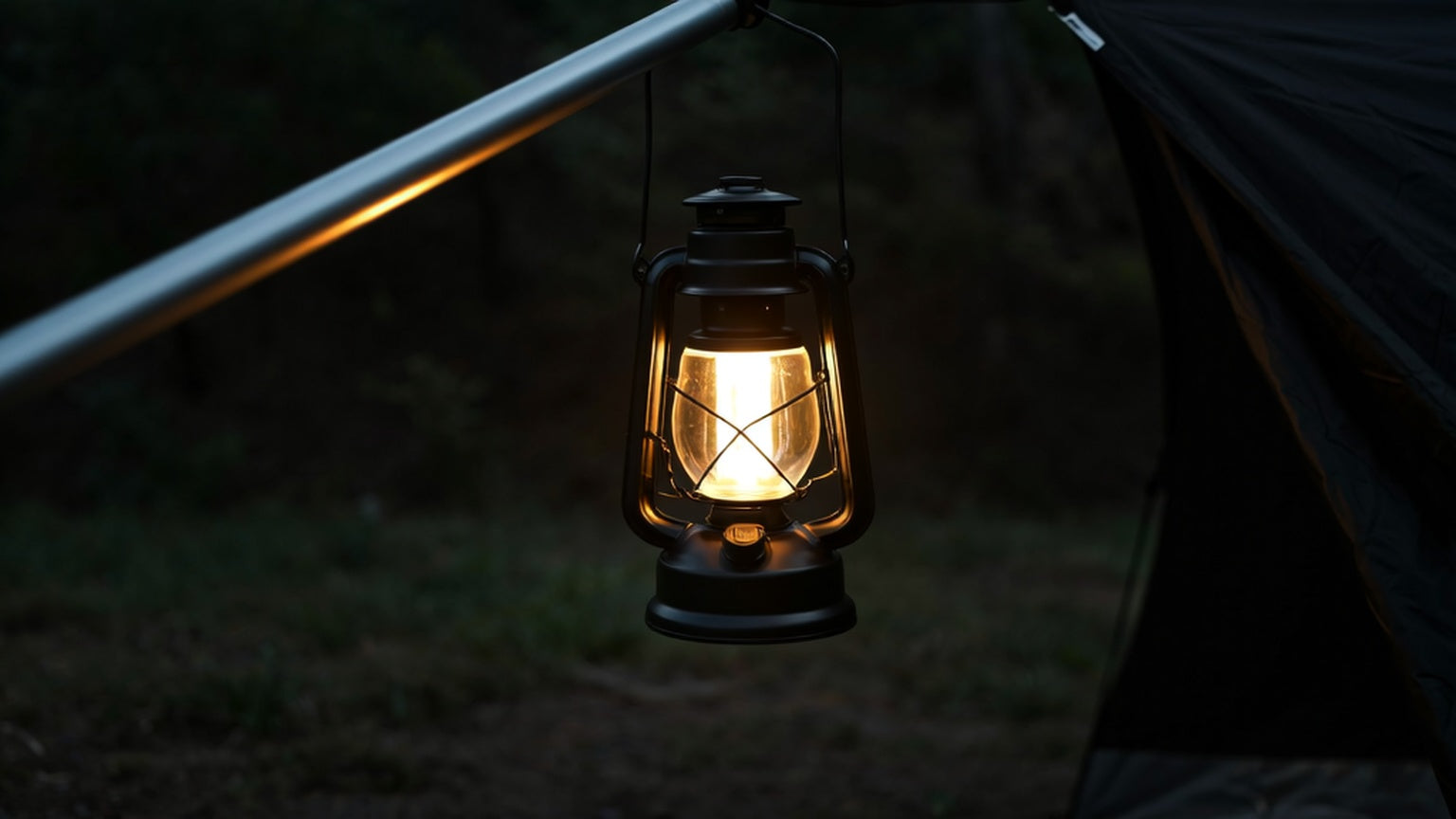 Outdoor camping lantern glowing beside a tent during an overnight hike